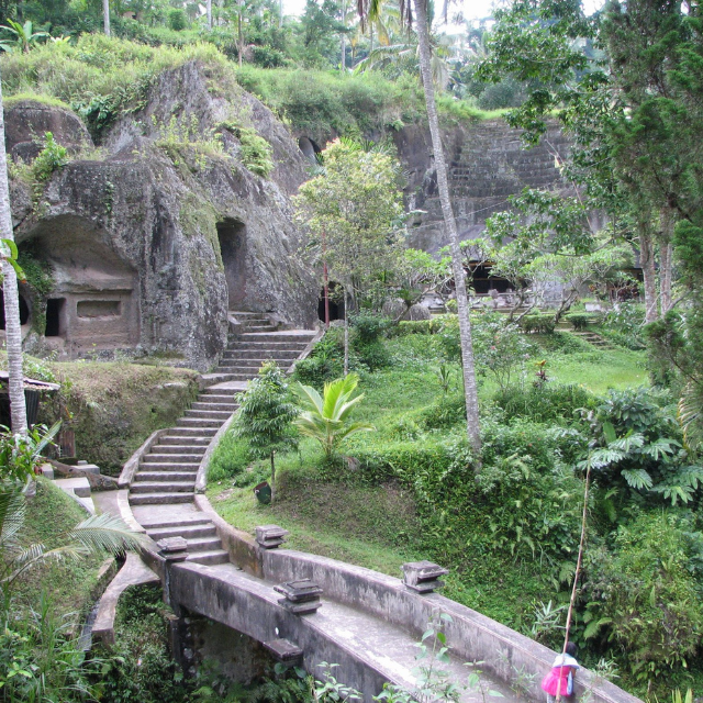 Ancient 11th-century royal tombs of Gunung Kawi carved directly into the rock cliffs of Tampaksiring, Bali.