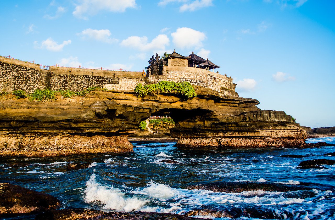 The iconic Tanah Lot Temple perched on a massive offshore rock.
